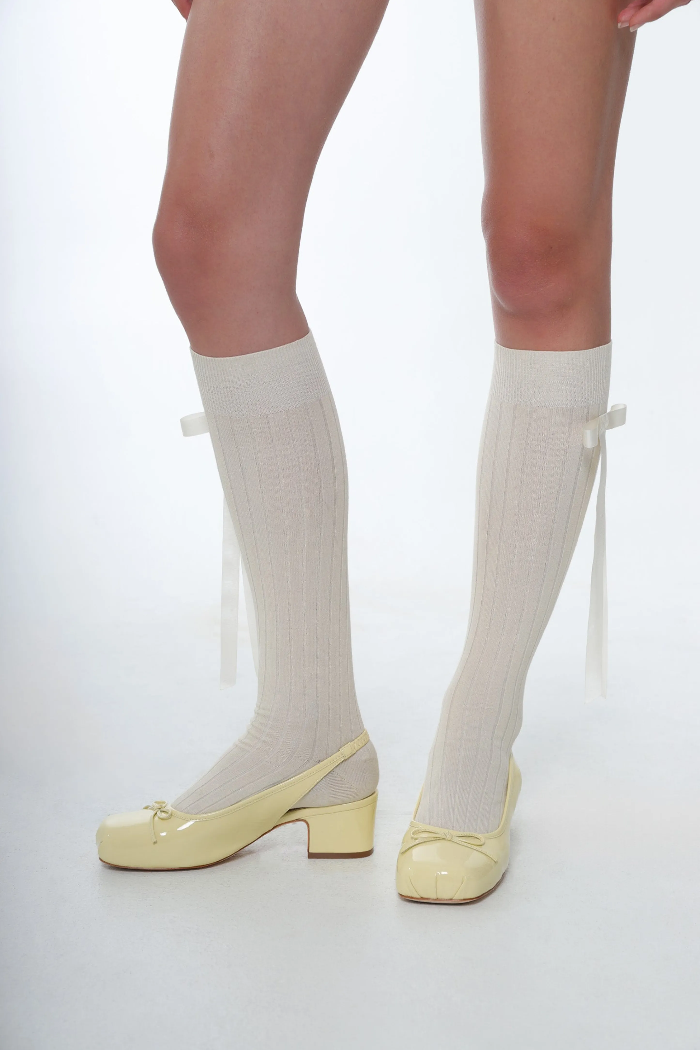 SLINGBACK 45 IN BUTTER PATENT